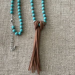 Suede tassel and faux turquoise necklace. Adjustable clasp great alone or layer